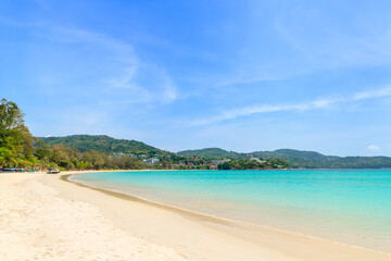 Fototapeta na wymiar Kata Beach with crystal clear water and wave, famous tourist destination and resort area, Phuket, Thailand