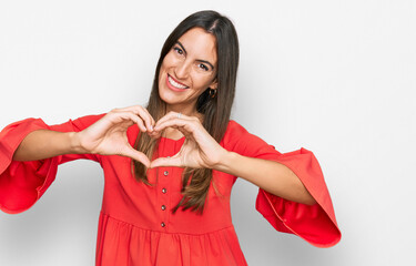 Young beautiful woman wearing casual clothes smiling in love showing heart symbol and shape with hands. romantic concept.