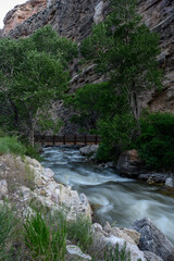 Fototapeta na wymiar Shell Creek Flows Below Hiking Bridge