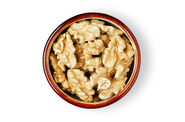 Peeled walnut kernels in a bowl. Isolated on a white background. Nuts contain vegetable protein and vitamins. For a healthy and vegetarian diet