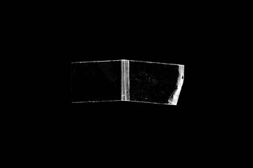 adhesive transparent tape on black background. abstract crumpled sticky tape for poster design...