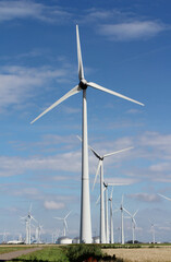 Summer view of the landscape and multi-fuel power station with wind turbines at Eemshaven, in Groningen, the Netherlands.