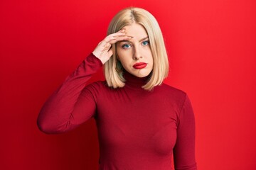 Young blonde woman wearing casual clothes worried and stressed about a problem with hand on forehead, nervous and anxious for crisis