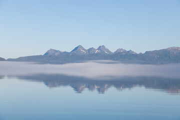 Fog on hills sunrise on ocean