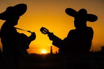 Mexican, Latin American, Spanish. Musicians at sunset.
