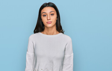 Obraz premium Young hispanic girl wearing casual clothes relaxed with serious expression on face. simple and natural looking at the camera.