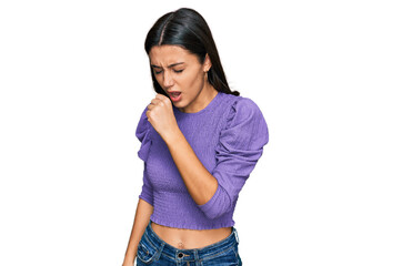 Young hispanic girl wearing casual clothes feeling unwell and coughing as symptom for cold or...