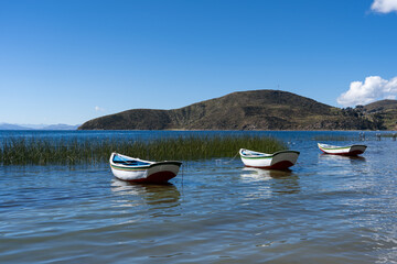 Boats at beach on Isla Del Sol in Bolivia