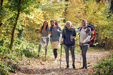 Couples in good mood enjoying beautiful sight while hiking