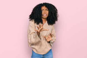 Young african american girl wearing casual clothes disgusted expression, displeased and fearful...