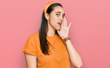 Young hispanic woman wearing casual clothes hand on mouth telling secret rumor, whispering malicious talk conversation
