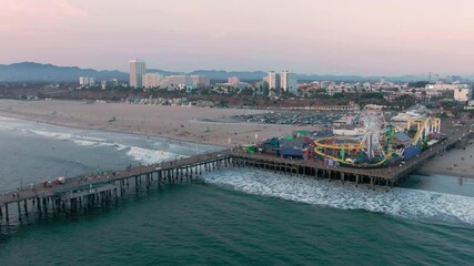 Aerial: Santa Monica Pier at sunset, Los Angeles, California, USA
