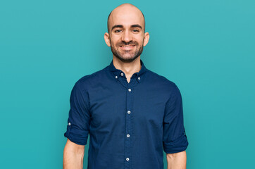 Fototapeta premium Young hispanic man wearing casual clothes with a happy and cool smile on face. lucky person.