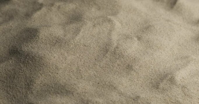 Close-up. Rotating sand background. Texture from sand. Desert Beach