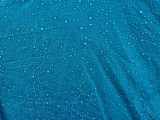 Water drops on waterproof membrane fabric. Morning dew on tent.