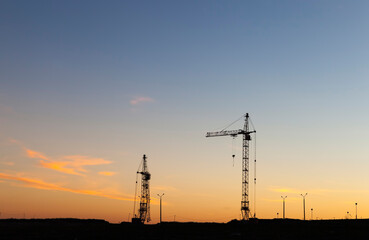 Fototapeta premium tall yellow construction crane