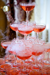 Crystal glasses for holiday, a lot of glasses for guests. Slide pyramid of glasses.