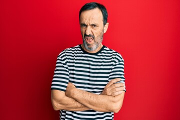 Middle age hispanic man wearing casual clothes clueless and confused expression. doubt concept.