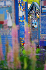 Blue painted wooden crosses in the Merry Cemetery in Maramures, an unique and amusing monument in the entire world