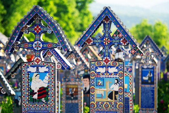 Blue painted wooden crosses in the Merry Cemetery in Maramures, an unique and amusing monument in the entire world