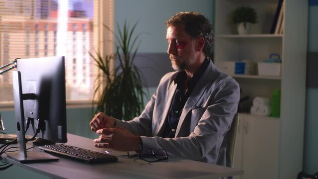 Male manager applying eye patches