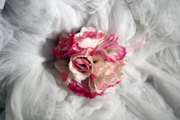 pink roses on white cloth