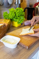 making morning sandwich at home kitchen