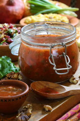 Georgian tkemali sauce on a wooden table
