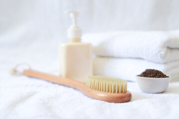 Fototapeta na wymiar Body Cleaning Brush, White Towels, Coffee scrub, Spa Salon