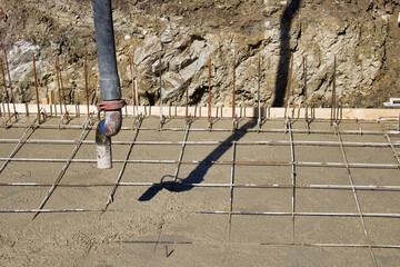 final part of concrete mixer arm with pump and its shadow
