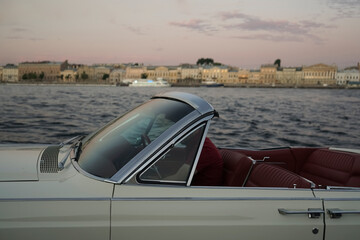American Classic Convertible Car.  white  retro cabriolet to the sunset. side view. Summer...