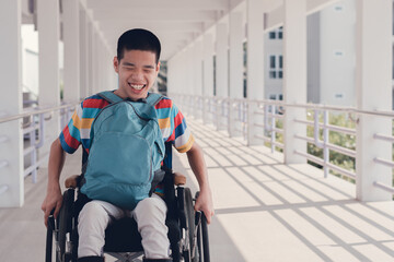 Disabled child on wheelchair enjoy learning how to use a wheelchair by yourself in hospital,...