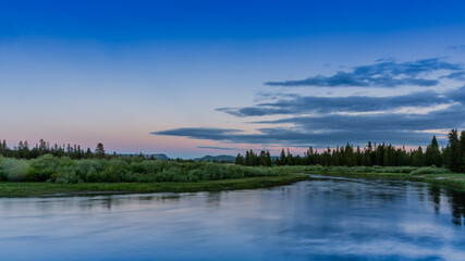 Obraz na płótnie Canvas Tranquil River Sunset