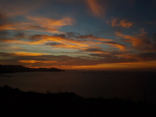 Scenic view of a calm coast during sunset with moutains in the background, Oran Algeria
