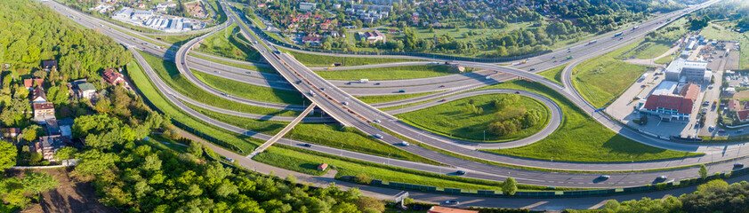 Highway multilevel crossing. Spaghetti junction on A4 international motorway, the part of freeway around Krakow, Poland. Aerial panorama