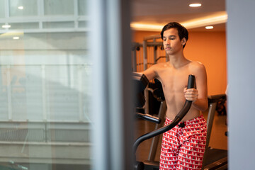 Teenage boy work out on treadmill in gym