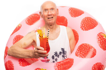 The man poses in a photo studio.