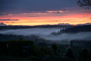 sunset and foggy landscape in the mountains of the Sauerland