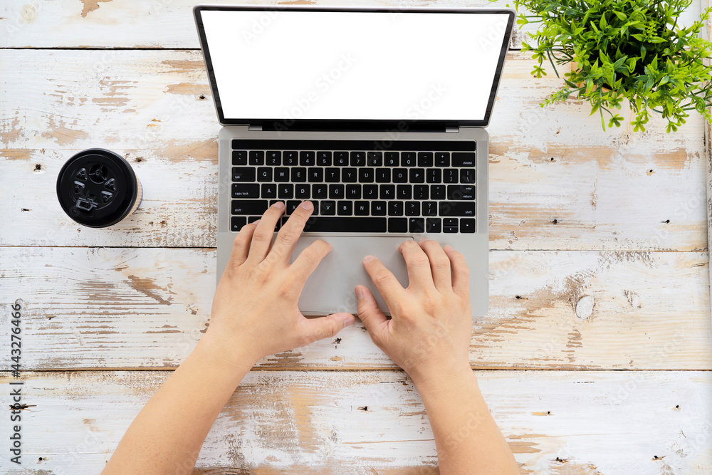 Aufkleber hand using and touching on laptop touchpad with blank white desktop screen