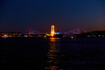 Evening boat trip on the Bosphorus in Istanbul. Bosphorus Bridge, in the night lights
