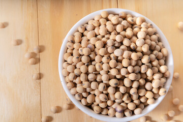 soya bean in a coffee mug on a wooden table.