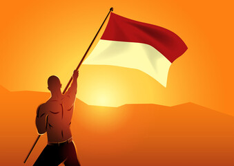 Muscular man holding the flag of Indonesia