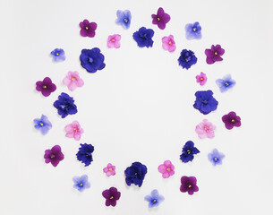 Floral frame from blue pink purple violets