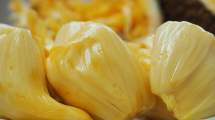 Close Up macro surface skin seedless texture Jackfruit ripe. Surface yellow sweet crunchy delicious Tropical fruit . Texture fruit background. Export Economy fruit Thailand & Asia.