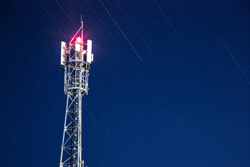 telecommunication tower in the evening - obrazy, fototapety, plakaty