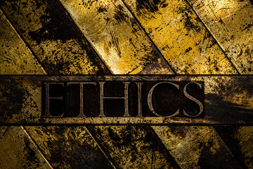 Ethics text on vintage textured copper and gold background