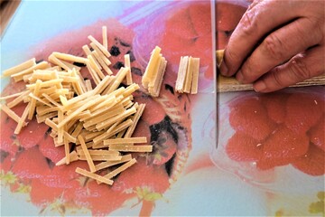 Preparing process of homemade Turkish noodle, selective focus. Noodles are the pasta that Turkish women make. It is called 