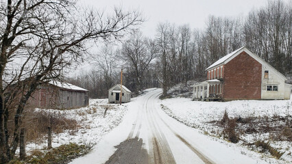 Old brick homestead on country road