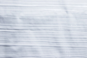 White paint strokes on the paper. Abstract background