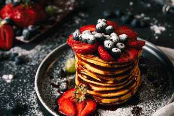 Pancake. Tasty pancakes with fruits, strawberries, berries, sugar. Pancakes with chocolate. Dessert. Breakfast pancakes.  - obrazy, fototapety, plakaty